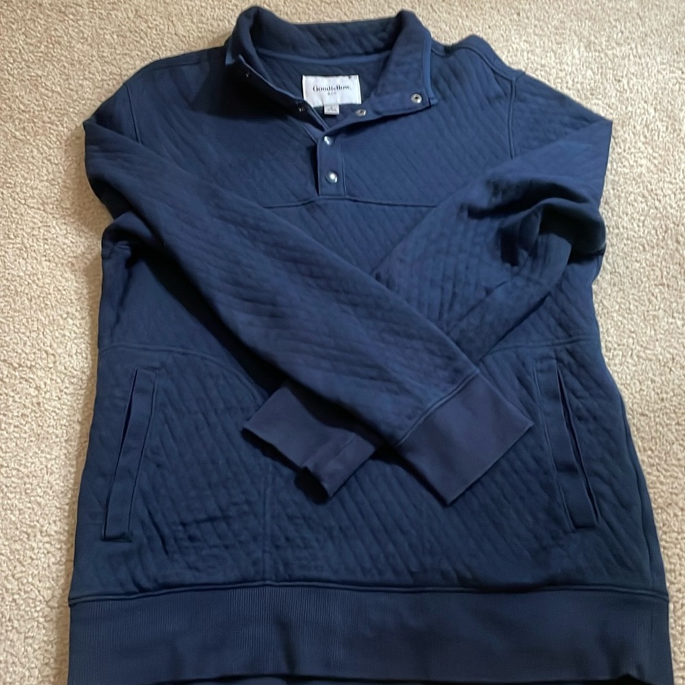 Quilted navy blue pullover.